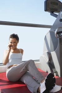 Woman on Cell Phone at Health Club